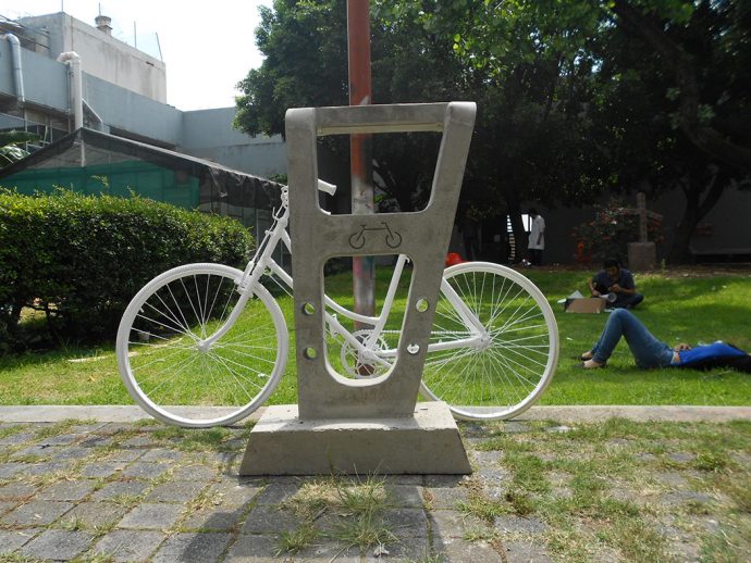 The Concrete Keeper of Bikes