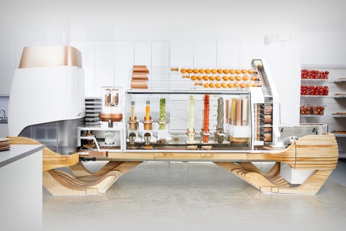 This elaborate machine automatically prepares and builds burgers!