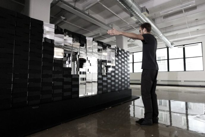Meet the massive interactive mirror that makes spellbinding pixelated patterns