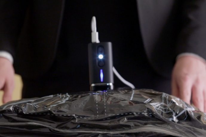 This Hand-held Vacuum Makes Space-efficient Packing a Breeze!