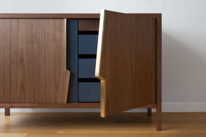 This ‘accidental’ lightning-bolt design detail doubles up as the cabinet’s handles