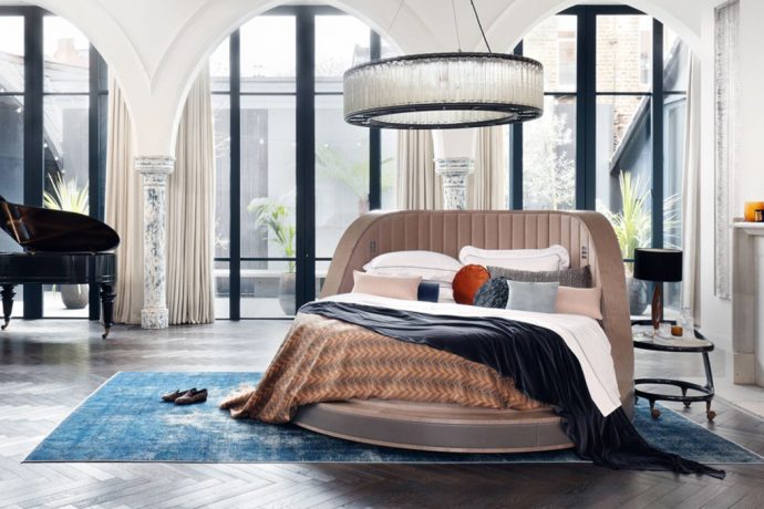 This luxurious bed spins 360°- from Netflix to breakfast to the french alps with one touch!