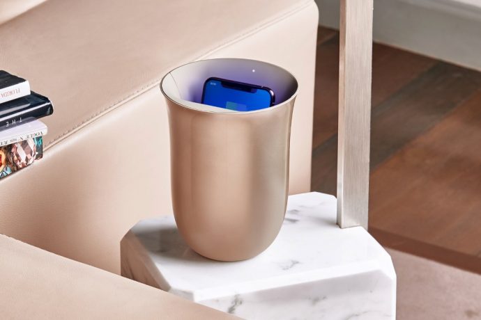 The Lexon Oblio wirelessly charges and sanitizes your phone at the same time