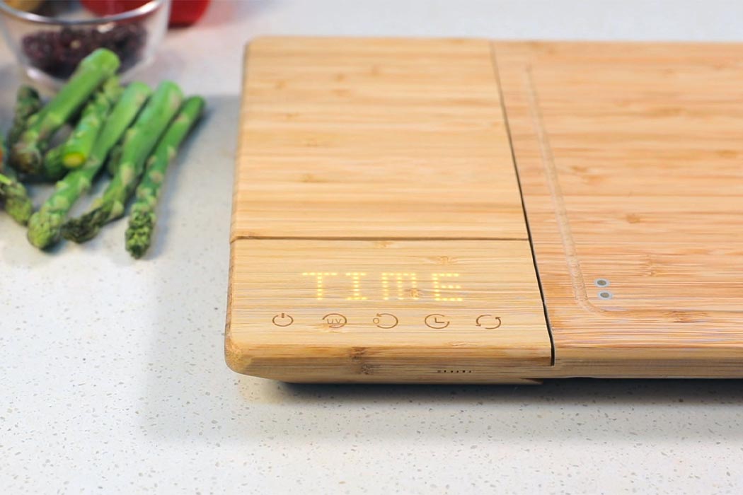 https://www.yankodesign.com/images/design_news/2020/09/this-sustainable-cutting-board-has-10-features-that-includes-killing-99-99-germs/01-chopbox_yankodesign.jpg
