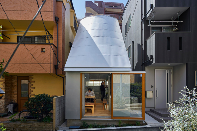 This tiny house in Tokyo boasts of a funnel-shaped roof that doubles as a skylight!
