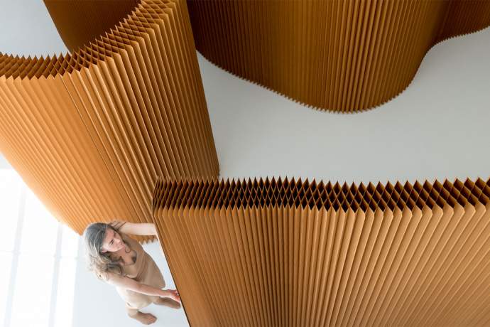 These flexible wooden room partitions expand up to 15 feet while folding down to the thickness of a book!