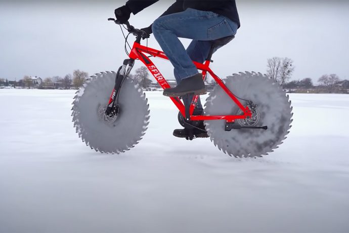 Circular saw blades replace the tires of this classic road bike to help it ride on ice!