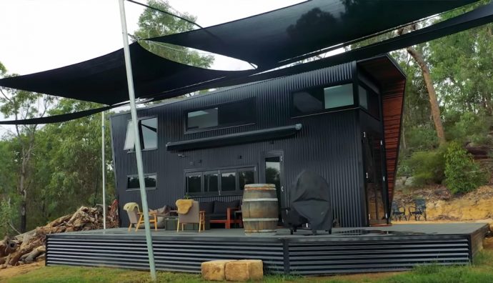 This ultra modern tiny home comes with a full-sized kitchen and high ceilings to make it feel anything but tiny!