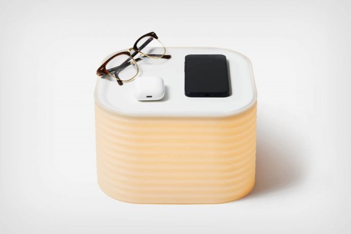 This sleek table-lamp doubles up as a bedside tray for organizing all your belongings
