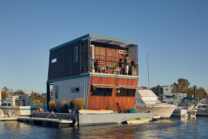 This shipping container has been repurposed into a floating home that adapts to changing sea levels!