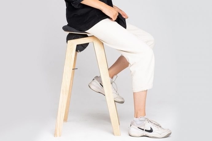 This ergonomic stool makes sitting down and standing up a whole lot easier!