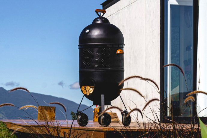 This outdoor 4-in-1 grill barbeques + makes pizzas in the summer, and keeps you warm in the winter!