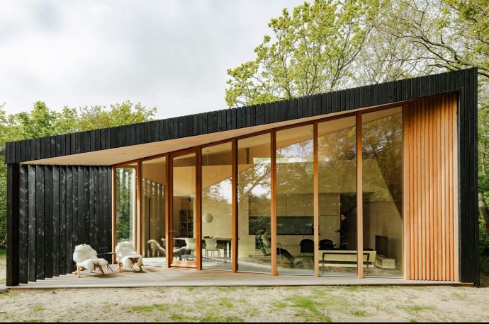 This prefab holiday home in Netherlands has transforming rooms that go from day to night instantly!