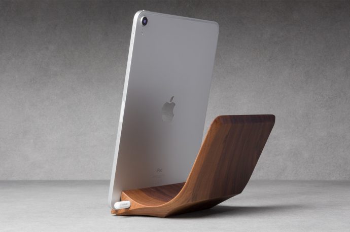 This handcrafted iPad Pro Stand carved from a single piece of wood comes with a magnetic Apple Pencil holder!