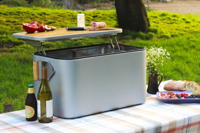 This outdoor recyclable cooler uses wool insulation to keep your drinks cool, and comes with its own charcuterie board lid!