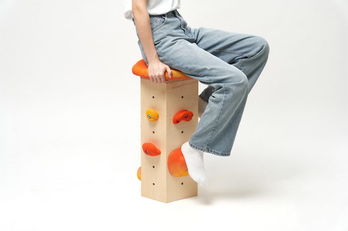 This playful bar stool uses rock climbing hand grips as foot rests to meet your feet wherever they fall!