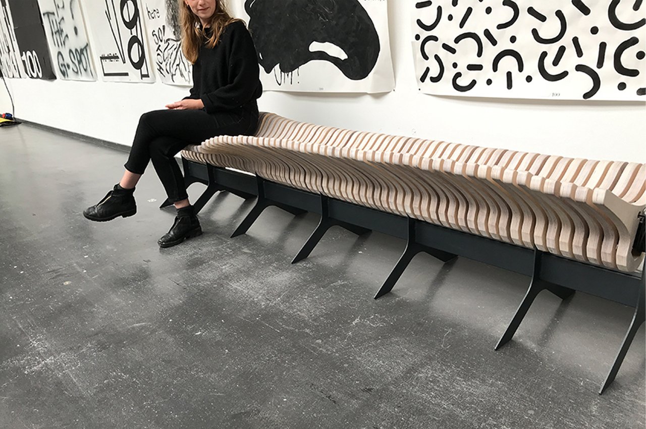 interactive bench design features movable wooden elements that mimic a kinetic wave! Yanko