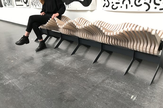 This interactive bench design features movable wooden elements that mimic a kinetic wave!