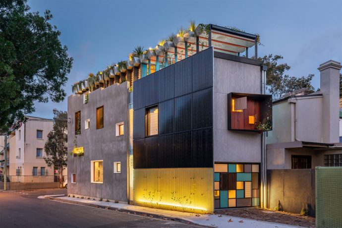 This sustainable house has an aquaponic system that connects a pond for edible fish & a rooftop garden!