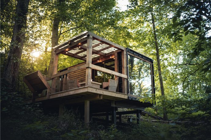 This tiny home built from an old shipping container brings modern design to an elusive forest environment!