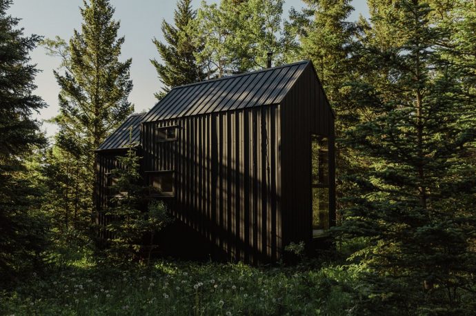 Two DIYers built this off-grid micro-cabin from repurposed steel and recycled building material for almost no cost!