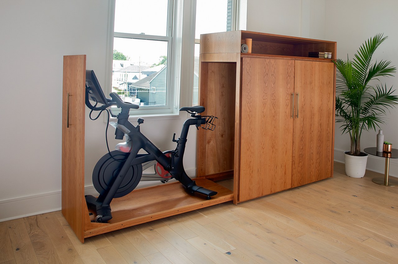 Peloton, meet Pottery Barn. This seemingly normal mid-century cabinet conceals your exercise bike inside.