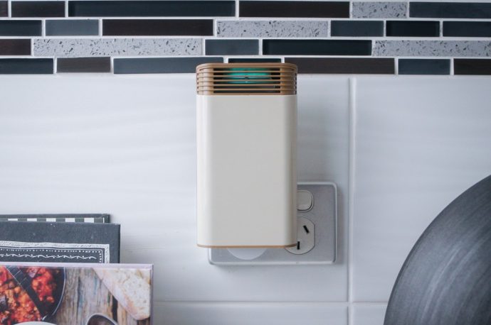 This tiny travel-friendly plug-in air purifier can deodorize an entire room… and it’s just as small as your iPhone