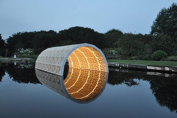 This 3D printed ceramic architectural sculpture looks like it is ethereally floating on a shallow pool!