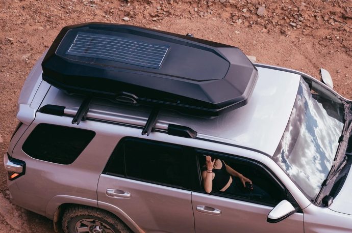 Rooftop cargo box equipped with solar panel is your ultimate outdoor road companion