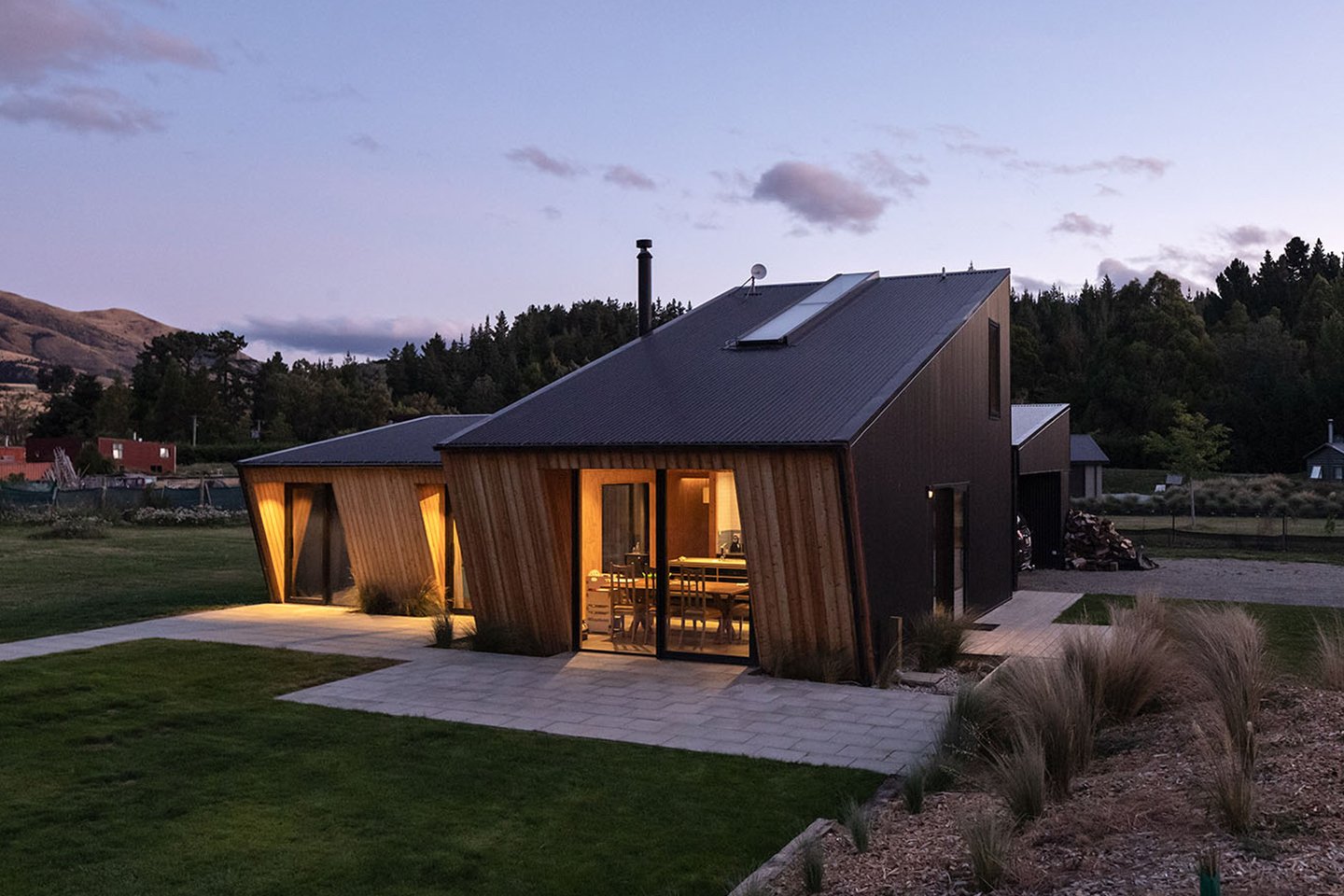 This angular passive house is built on a tilt in New Zealand and leans into the wind!