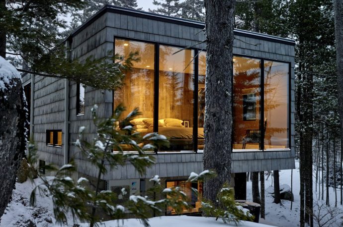 A floating cabin with a winding boardwalk is the magical winter retreat to help connect with nature!