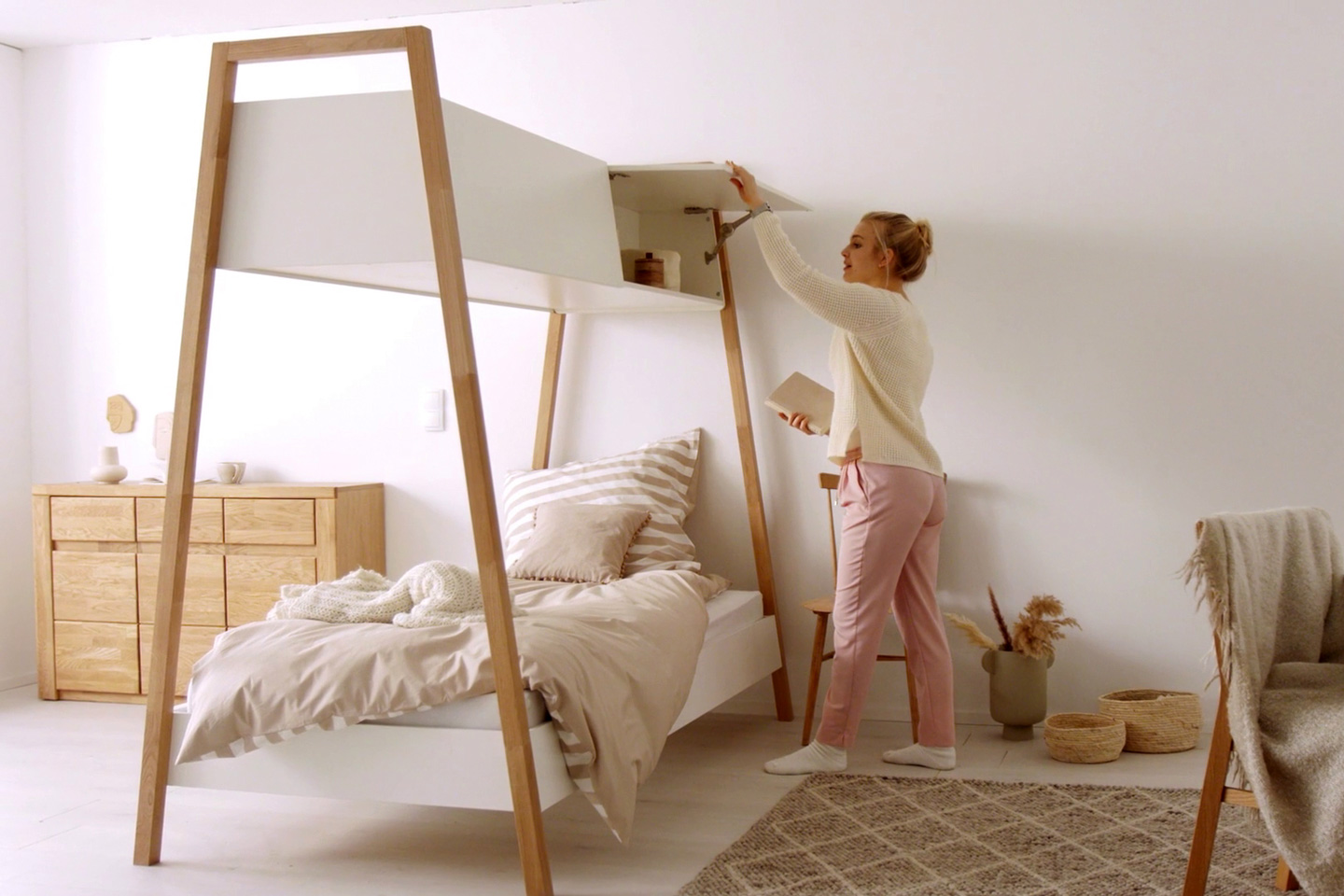 This crafty little bed comes with overhead storage… just like on an airplane!