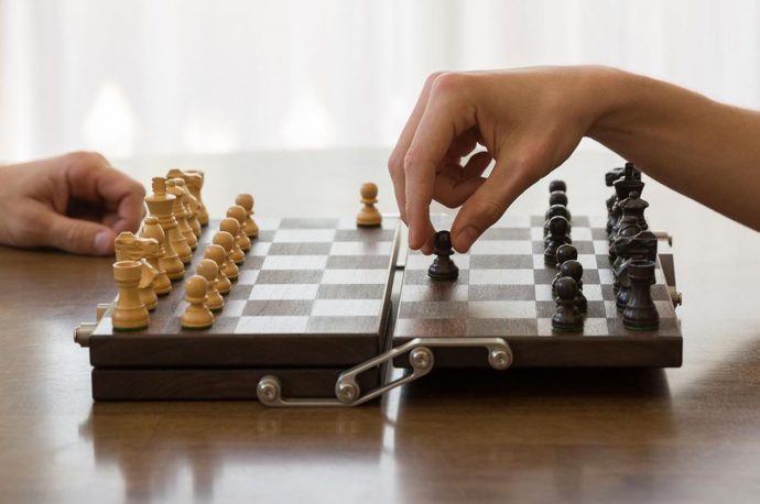 This origami engineered chess board unfolds in the most oddly-satisfying way. Watch the video!