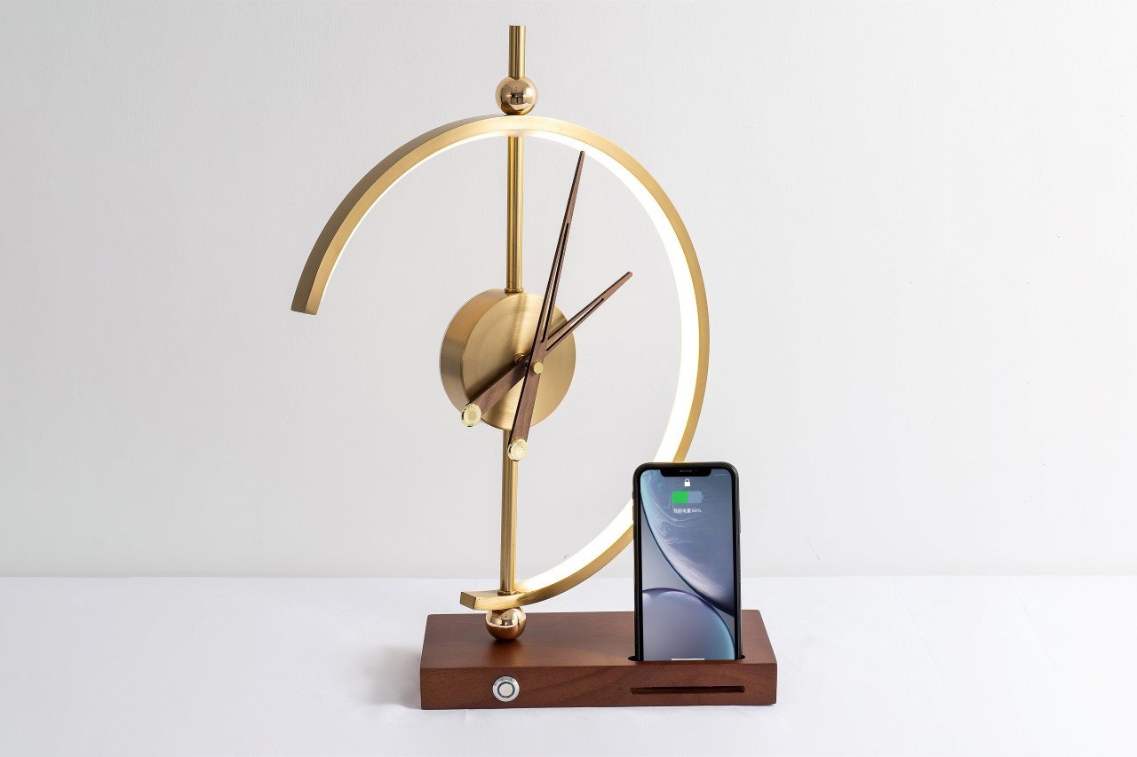 The Khonsu clock lamp is a weirdly attractive tabletop accent piece that  also wirelessly charges your phone - Yanko Design