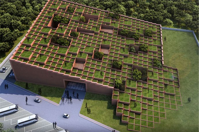 A staggered green roof gives this educational building organic architecture with sustainable building practices!