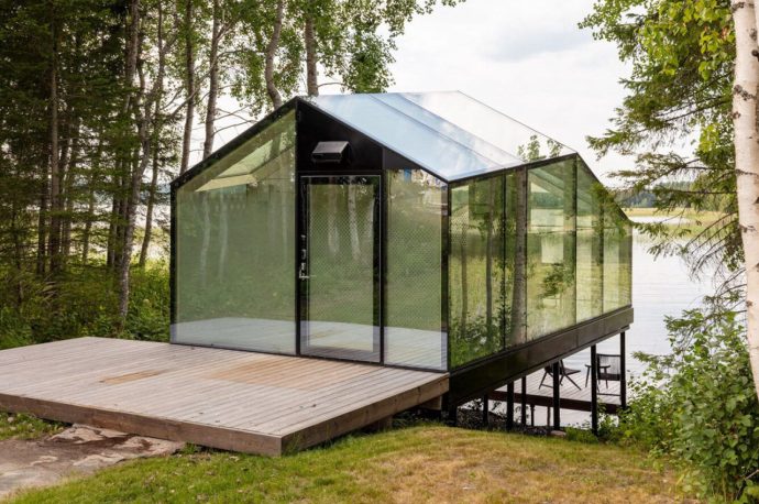 A tiny glass cabin lets you enjoy Finnish nature in warmth and safety