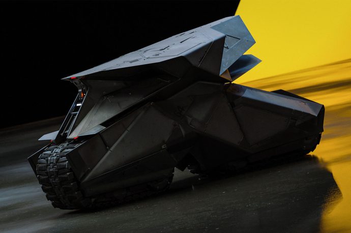 Electric Batpod is a turbine-engine powered ride with tank tread wheels that sits in Batman’s underground cave