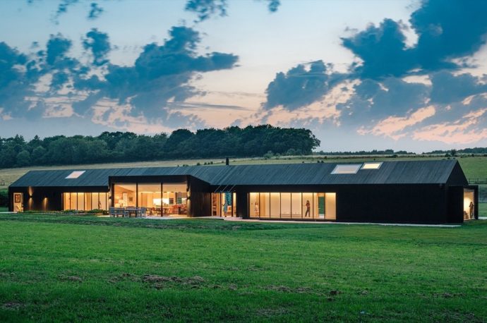 This prefab traditional farmhouse finds a contemporary twist with energy-efficient building practices
