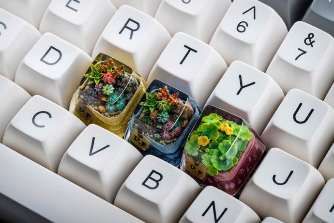 Adorable tiny keycap terrariums add a touch of greenery to your keyboard!