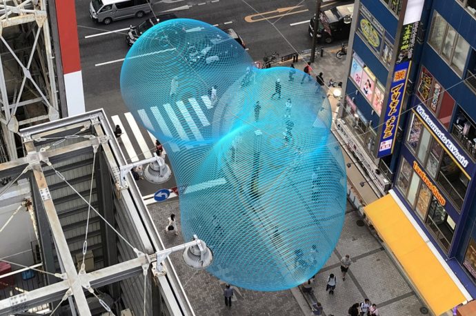 An enigmatic cloud floats above Tokyo streets in this mesmerizing art installation concept