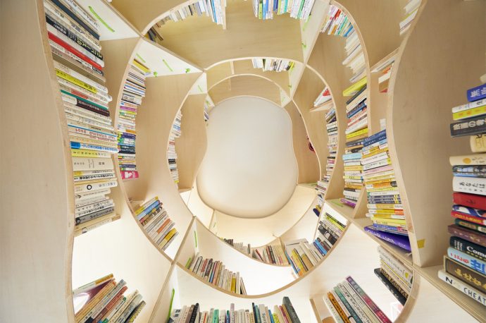 This multifunctional WFH unit combines a library with integrated desks to feed our curiosity while we work