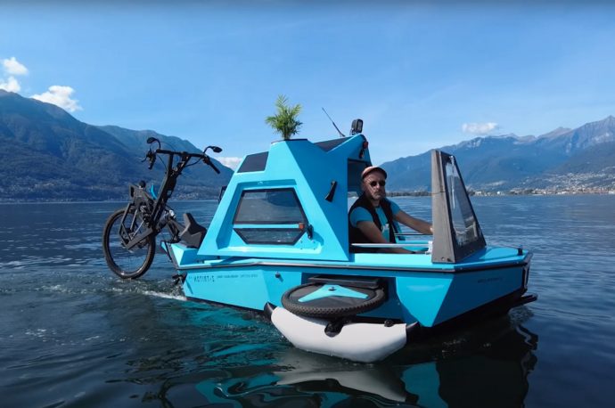 This 3-in-1 tiny camper, trike, and boat combo is actually an electric home on land and water