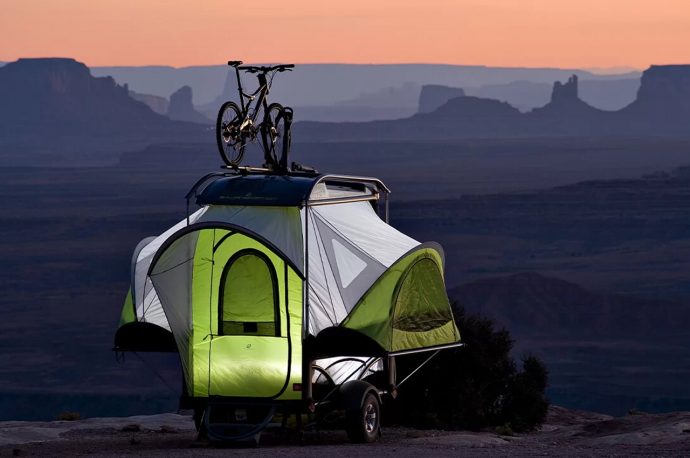 This camper trailer expands to sleep 4 people and haul all your outdoor gear with it