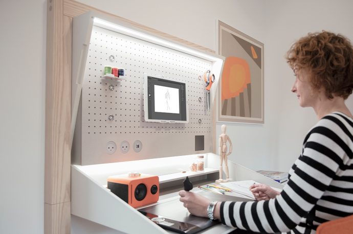 This WFH solution incorporates hidden storage spaces and a flip-down desk for all your working needs