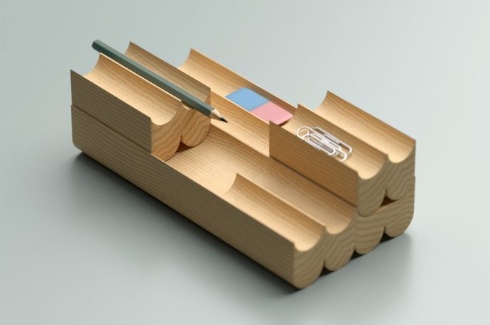This wooden desk organizer has a modular design to fit all of your stationery items