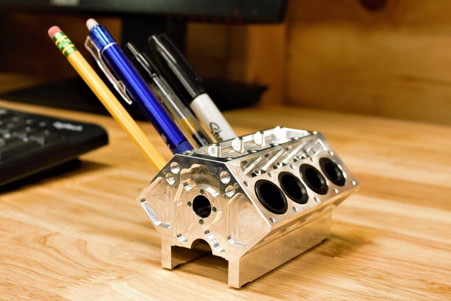 This miniature V8 Engine Block Pen Holder is the ultimate tabletop
