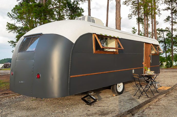 This retro-inspired travel trailer with tastefully renovated interiors is embodiment of color and space utilization