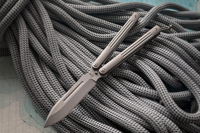 This fully-functioning Balisong-style pocket knife is an ideal EDC with rustproof Terravantium blade