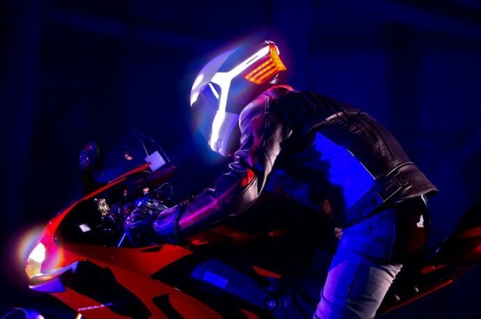 This cyberpunk motorcycle helmet comes with safety features like a 360° light, intercom, and safety beacon