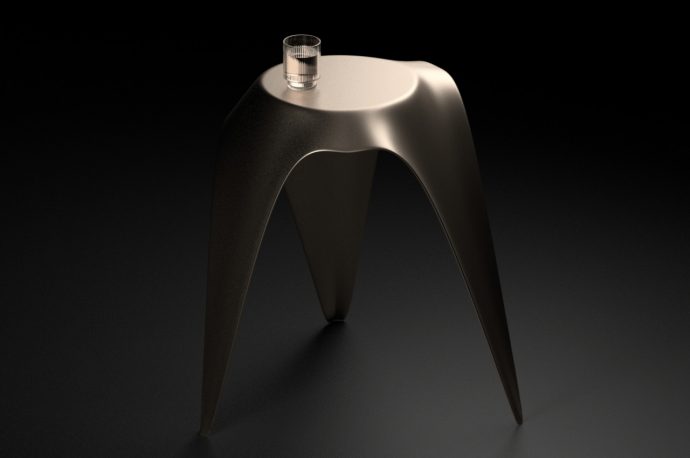 This metal side table depicts a piece of falling fabric frozen in time